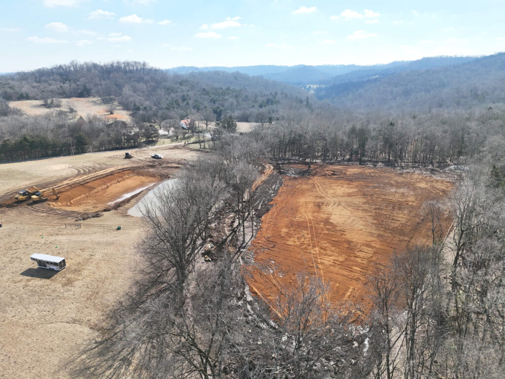 Caterpillar Excavator, Articulated Hauler, Construction Trailer.